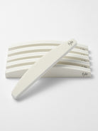 Double-sided nail buffer 240 grit showing flexible foam core and professional finish