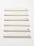 Close-up of 240 grit nail buffer showing double-sided design and flexible spine