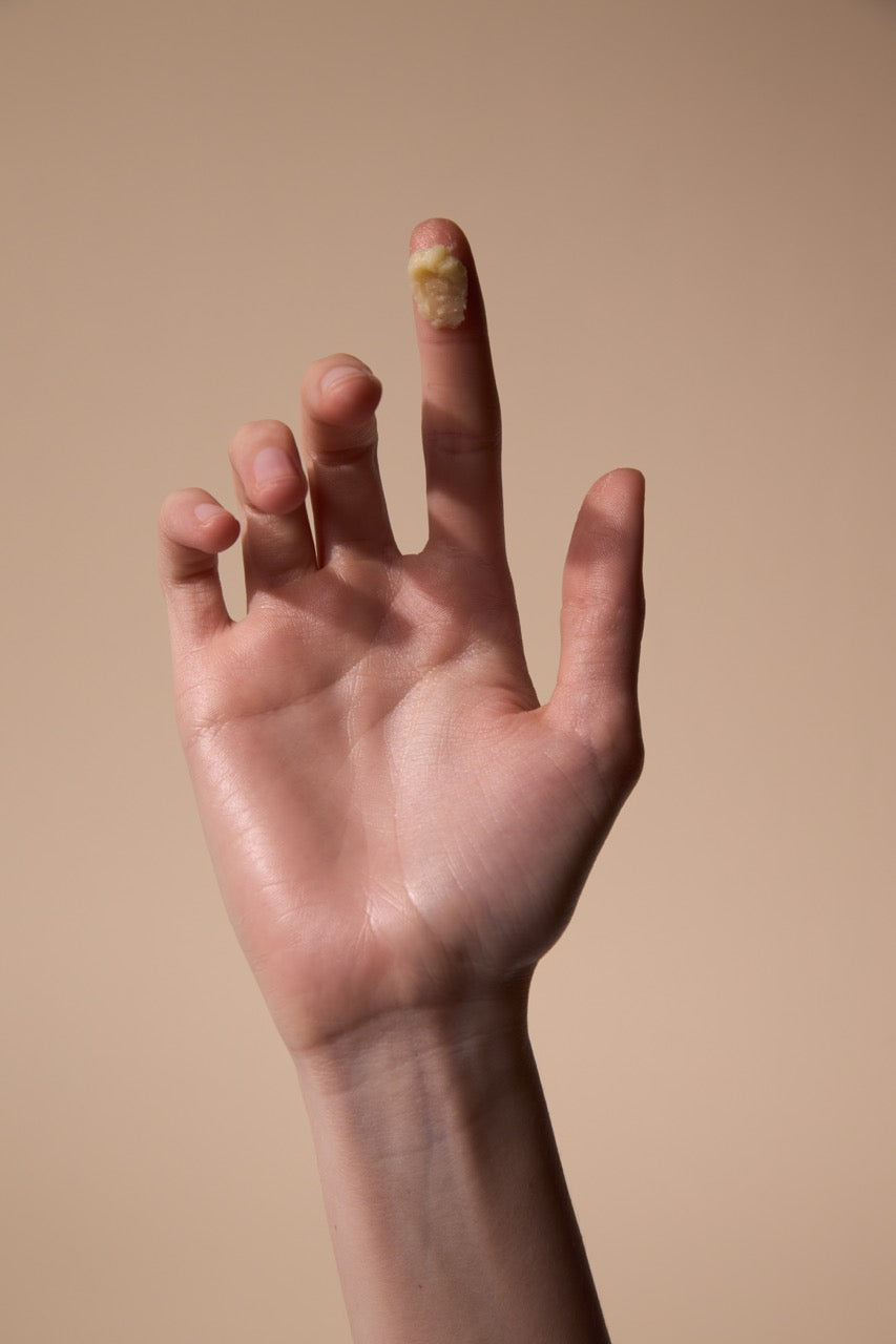 Hand with neat cuticles and soft skin after applying Fyle Cuticle Sealing Balm.